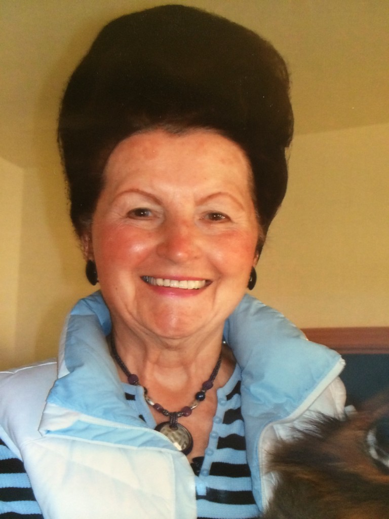 Omi with her dog Yogi in Eureka in 2010. The beehive still hanging in there, although not at its highest peak.  